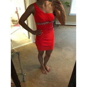 Coral colored one shoulder dress with gems